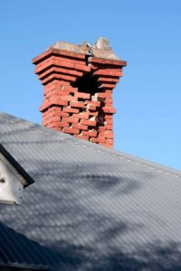 damaged masonry chimney