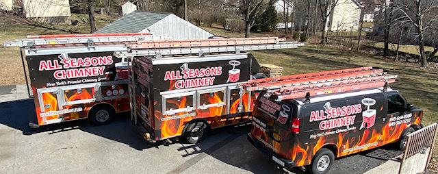 All Seasons Chimney Trucks and Vans In A Line